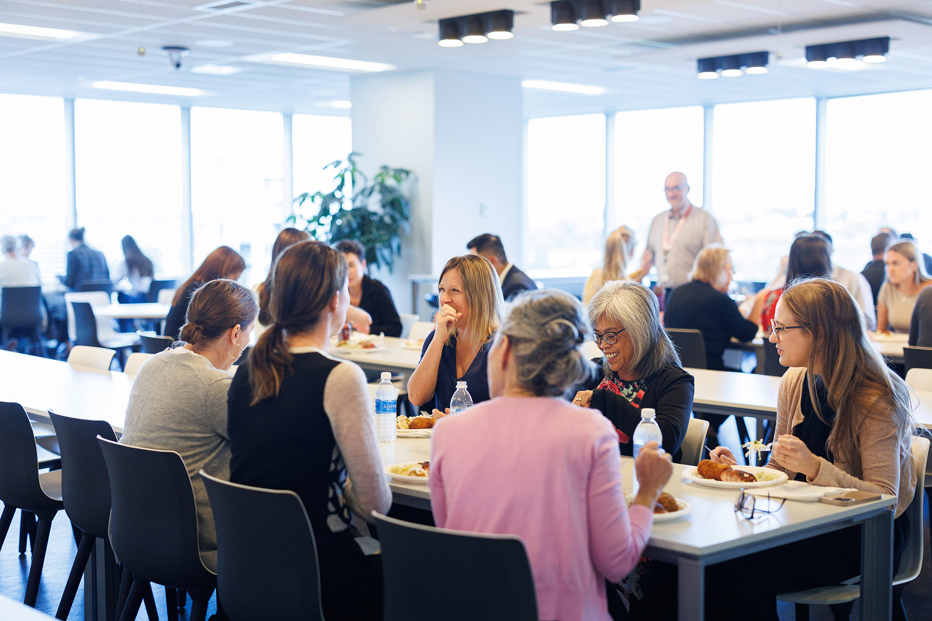 Birchcliff staff eating lunch in cafeteria